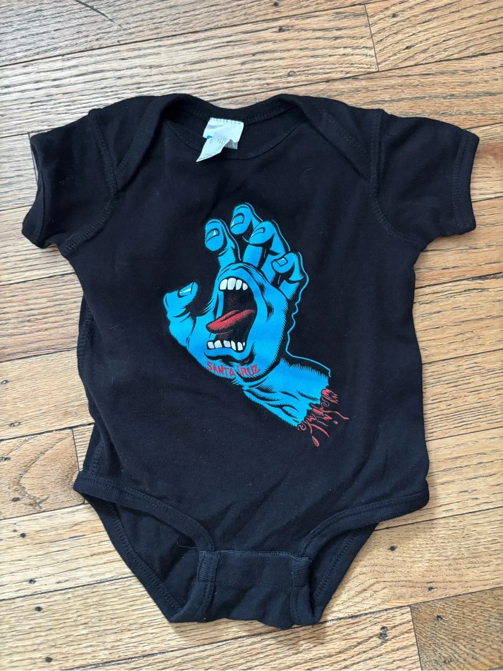 Santa Cruz Black Baby Bodysuit with Blue Screaming Hand Graphic